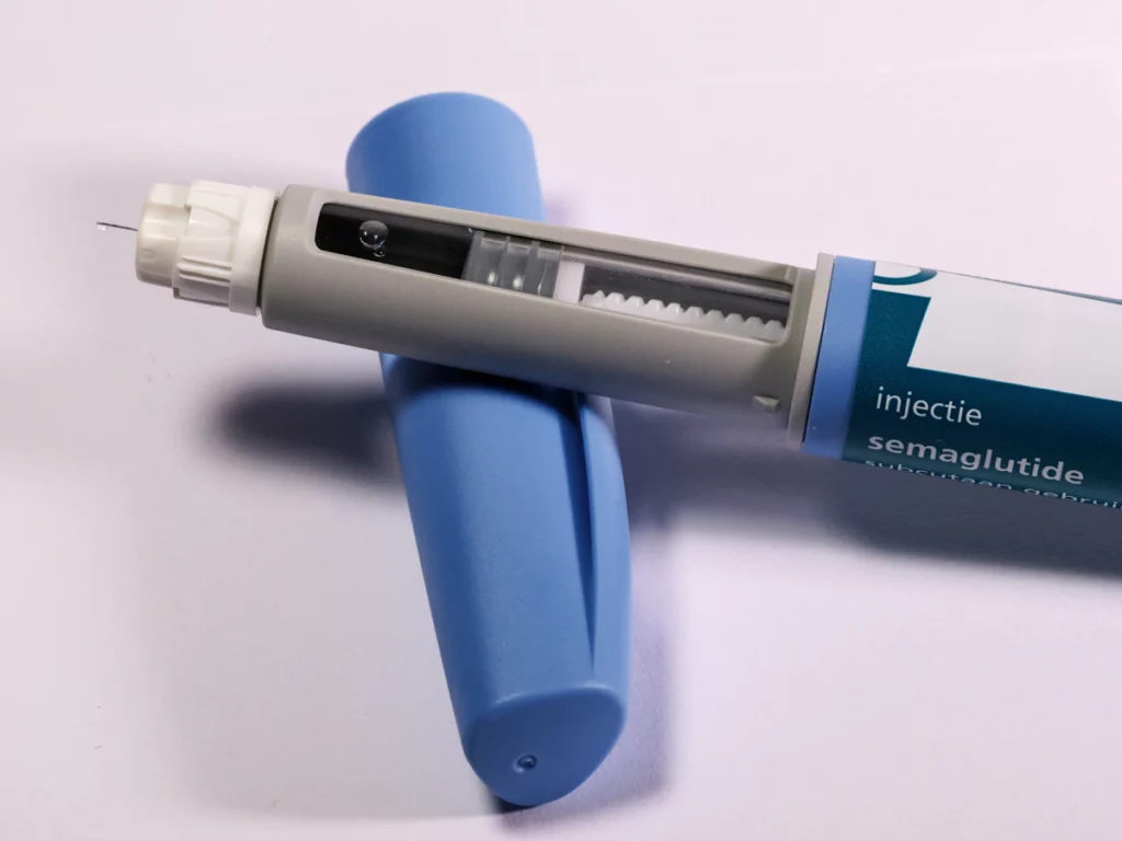 Weekly injection pen on a table